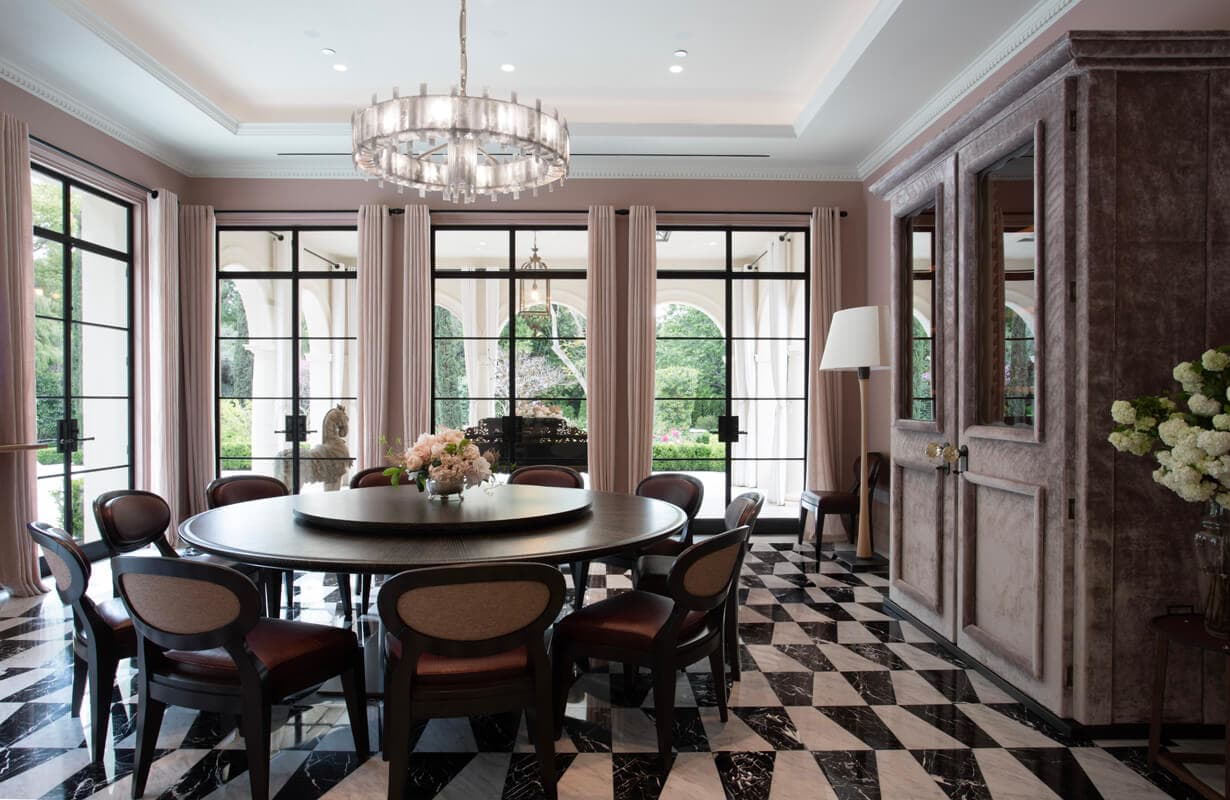 Dining room with steel casement windows and a view to the loggia