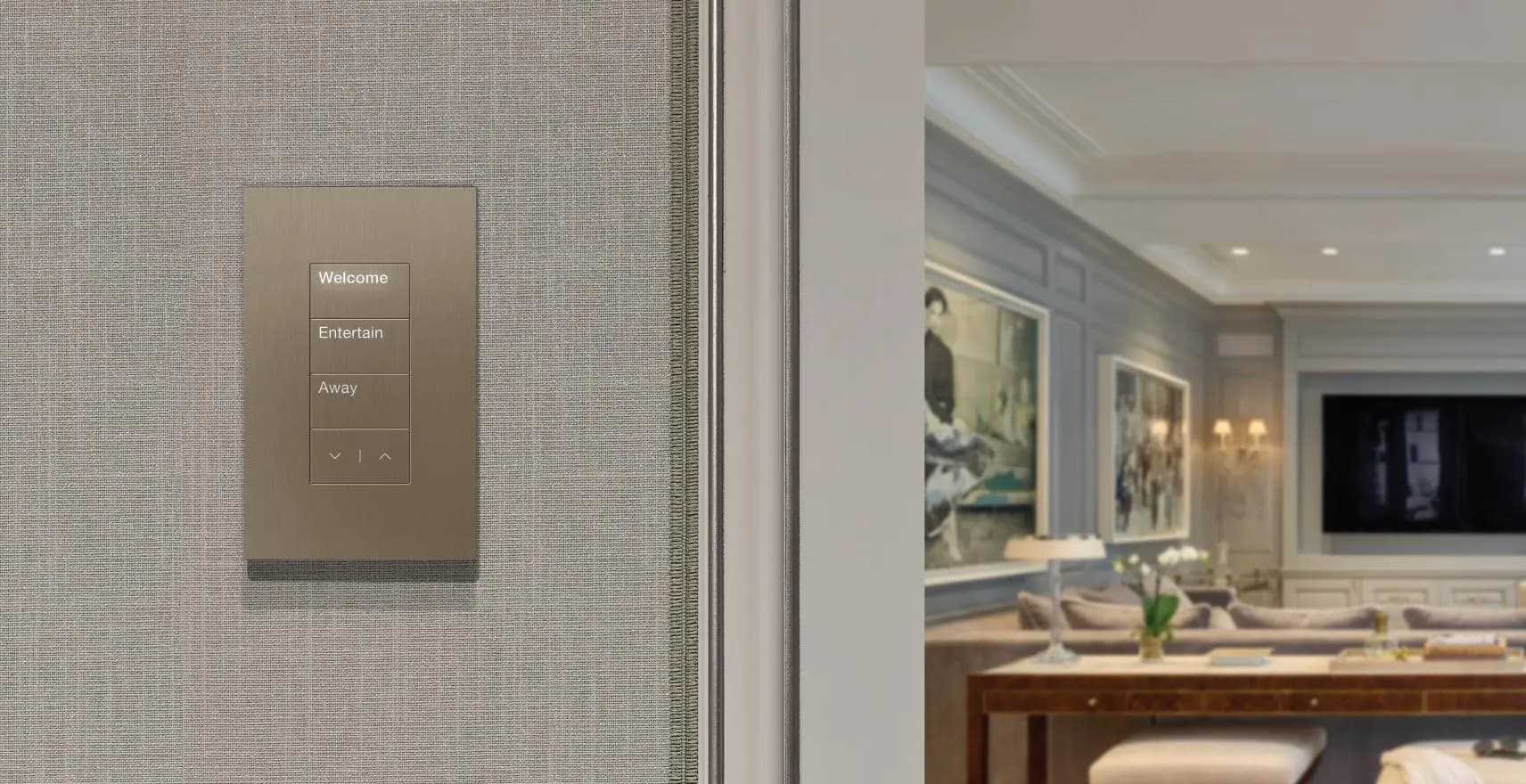 A Palladiom keypad in brushed metal on a fabric-wrapped wall in a luxury residence